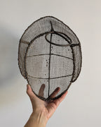 Interior view of 19th-century fencing mask showing original wire frame construction