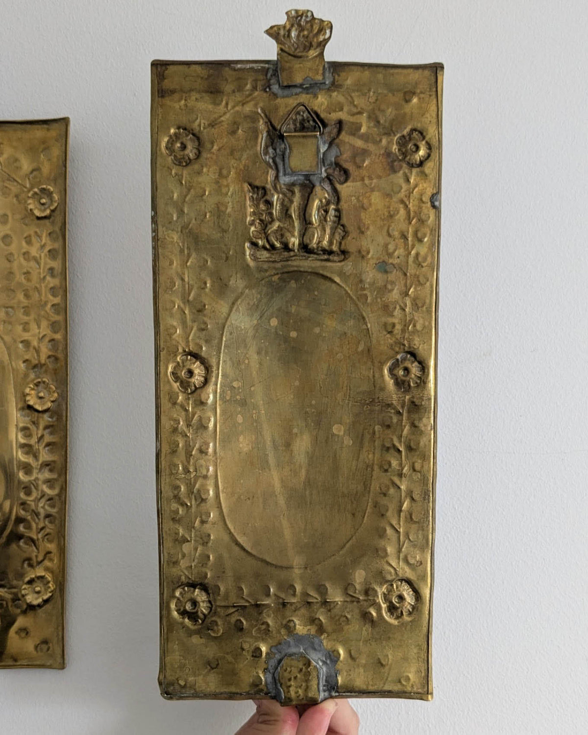 Pair of antique Swedish brass wall candle sconces with floral decoration and winged cherubs