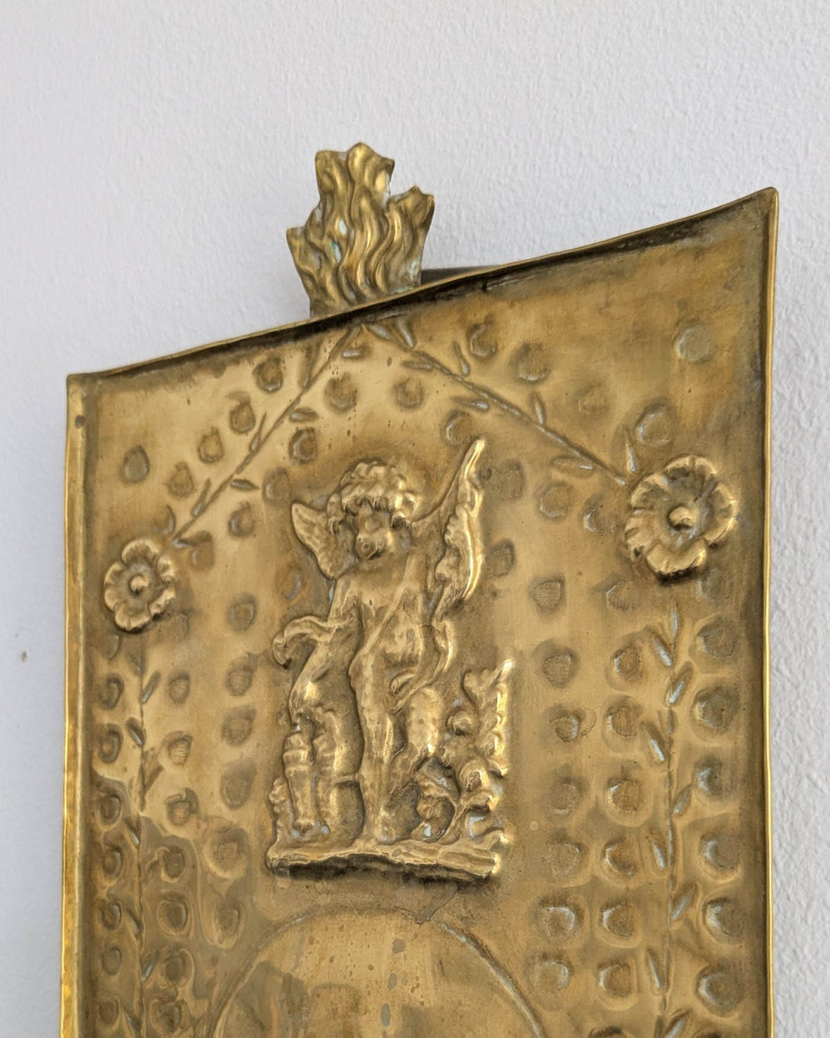 Pair of antique Swedish brass wall candle sconces with floral decoration and winged cherubs