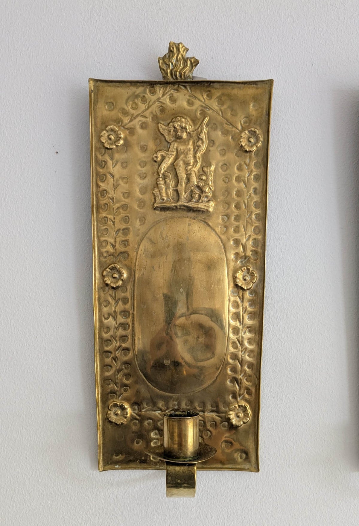 Pair of antique Swedish brass wall candle sconces with floral decoration and winged cherubs
