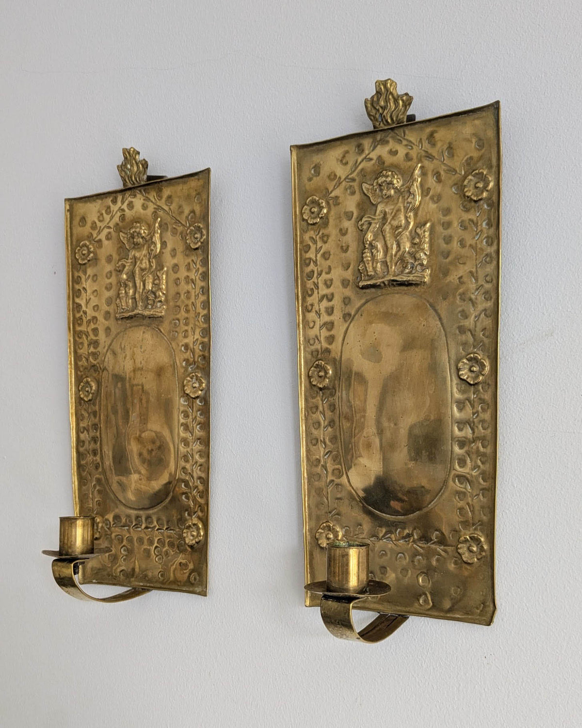 Pair of antique Swedish brass wall candle sconces with floral decoration and winged cherubs