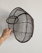 Rear view of antique French fencing mask showing metal support and strap loop