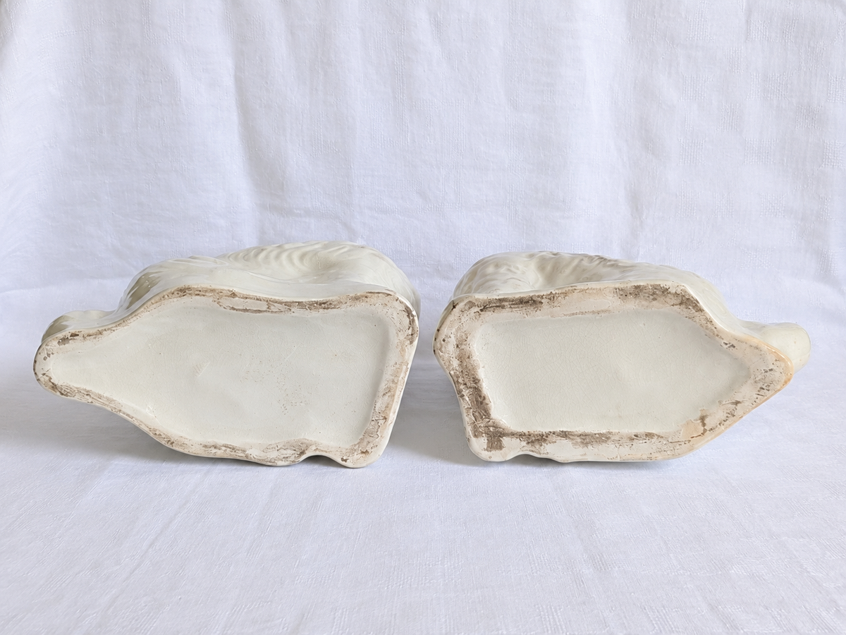 Base of antique Victorian Staffordshire spaniel showing age-related wear