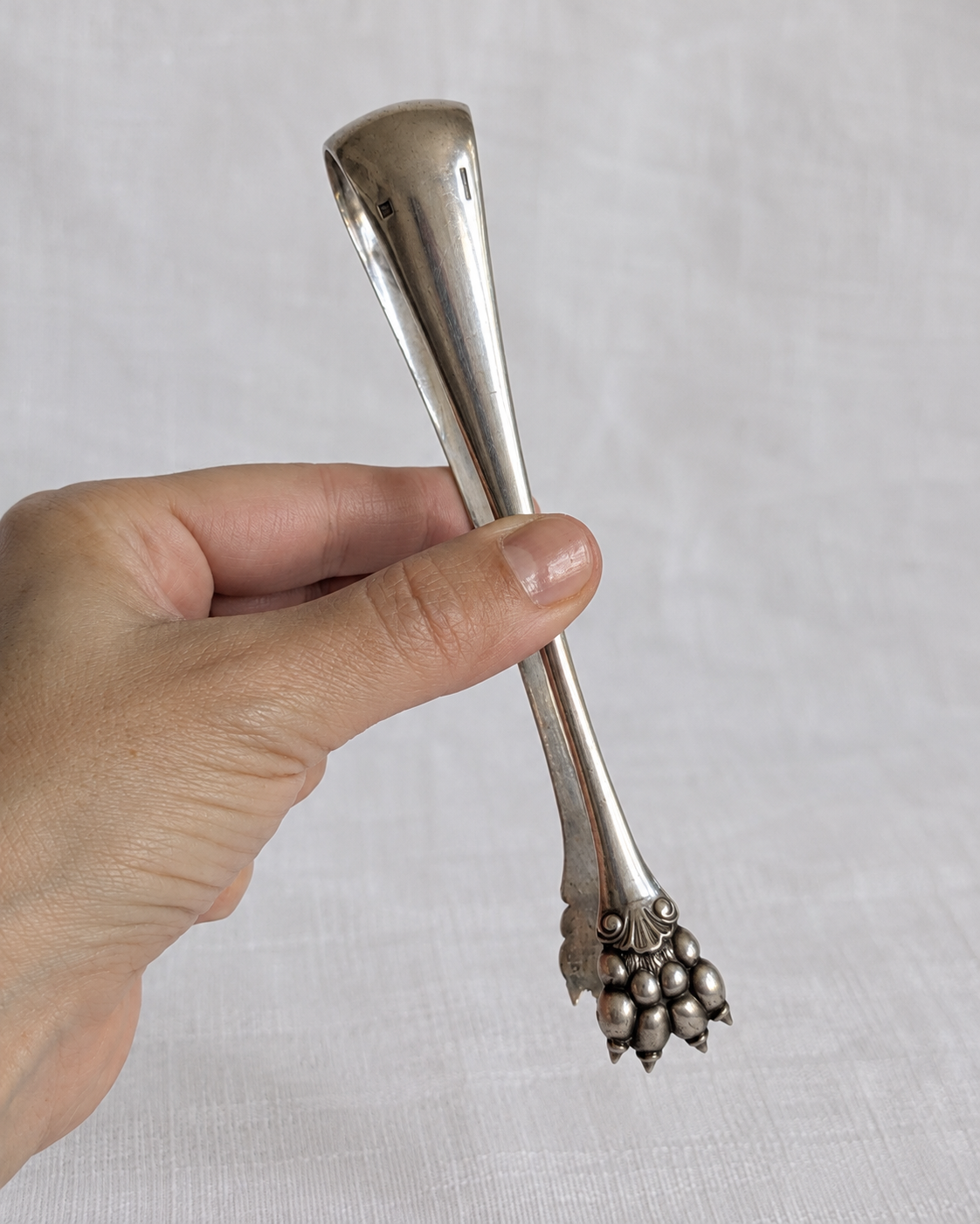 Antique Christofle sugar tongs with sculpted lion paw grips