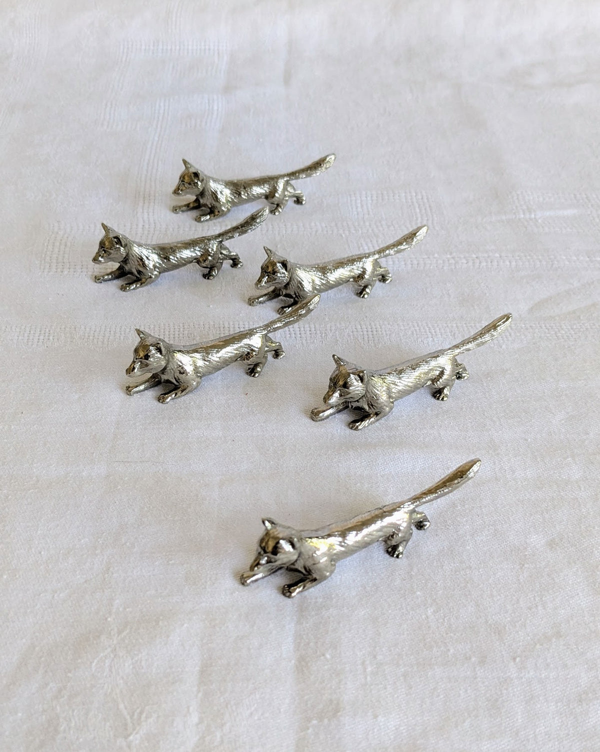 Six vintage fox-shaped knife rests in chrome-plated metal
