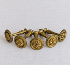 Original gilt finish on antique French bronze curtain tieback