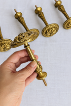 Side view of Napoleon III gilt bronze curtain tieback hook
