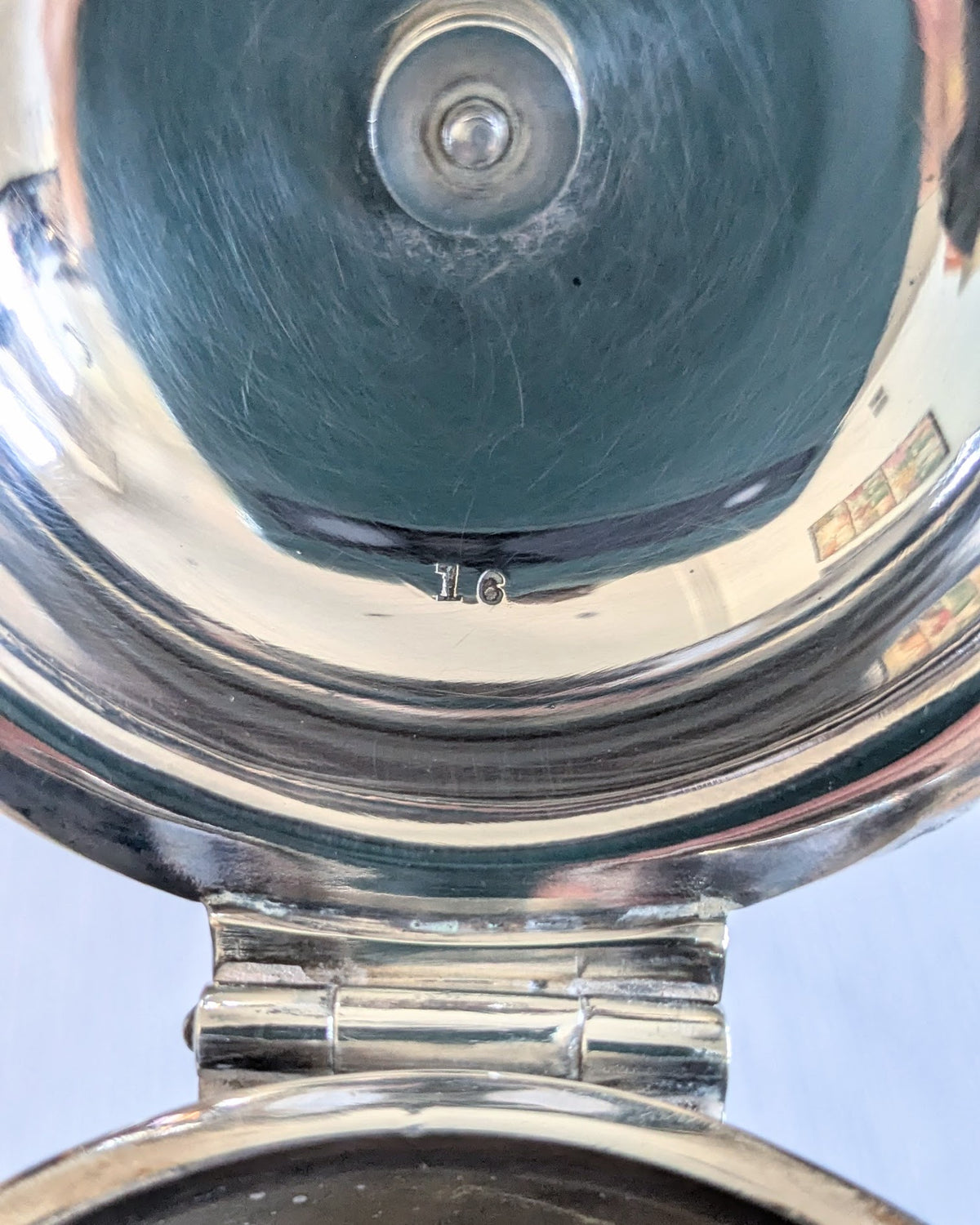 Underside of antique Hukin & Heath silver-plated coffee pot showing maker's marks