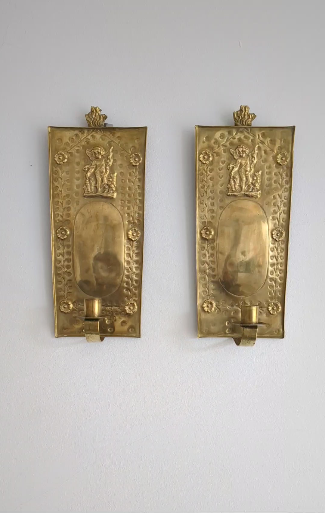 Pair of antique Swedish brass wall candle sconces with floral decoration and winged cherubs