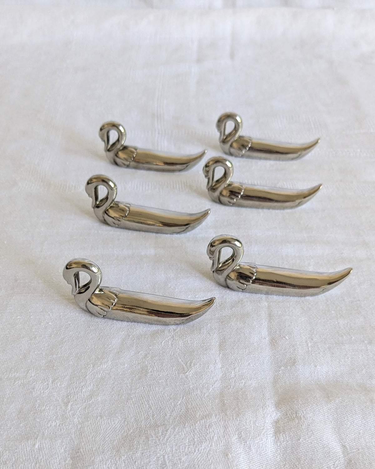 Set of six vintage stainless steel swan knife rests